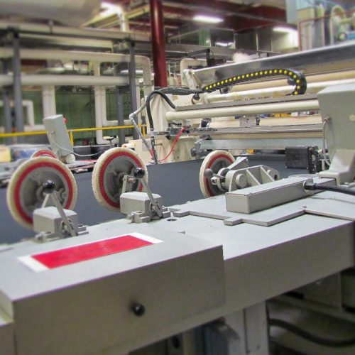 A machine designed to apply coatings to custom fabrics used in footwear components and constructions, industrial covers and protective enclosures, protective and performance gear, transportation and material handling products, as well as specialty consumer and commercial applications.