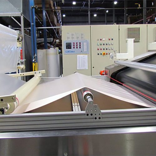 Machine and roller of a specialized machine that seals multiple layers into a single custom film.
