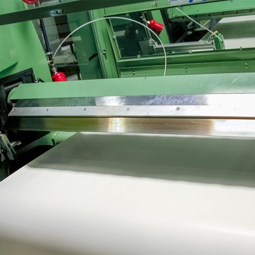 Green machine with large cutting blade designed to cleanly cut films and materials with custom coatings.